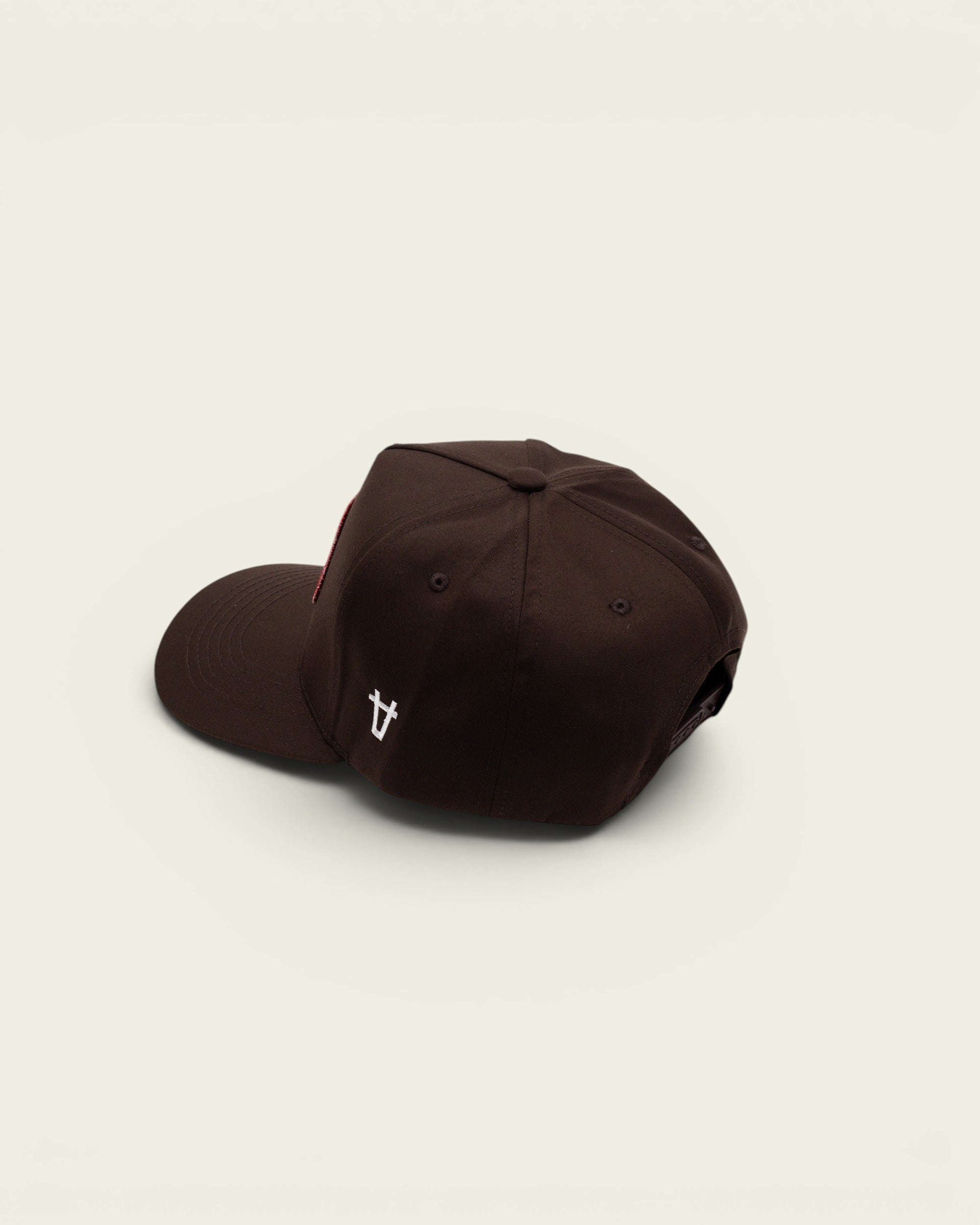 Ayredale Ranch & Co dark brown baseball cap with a red front patch and white side logo embroidery
