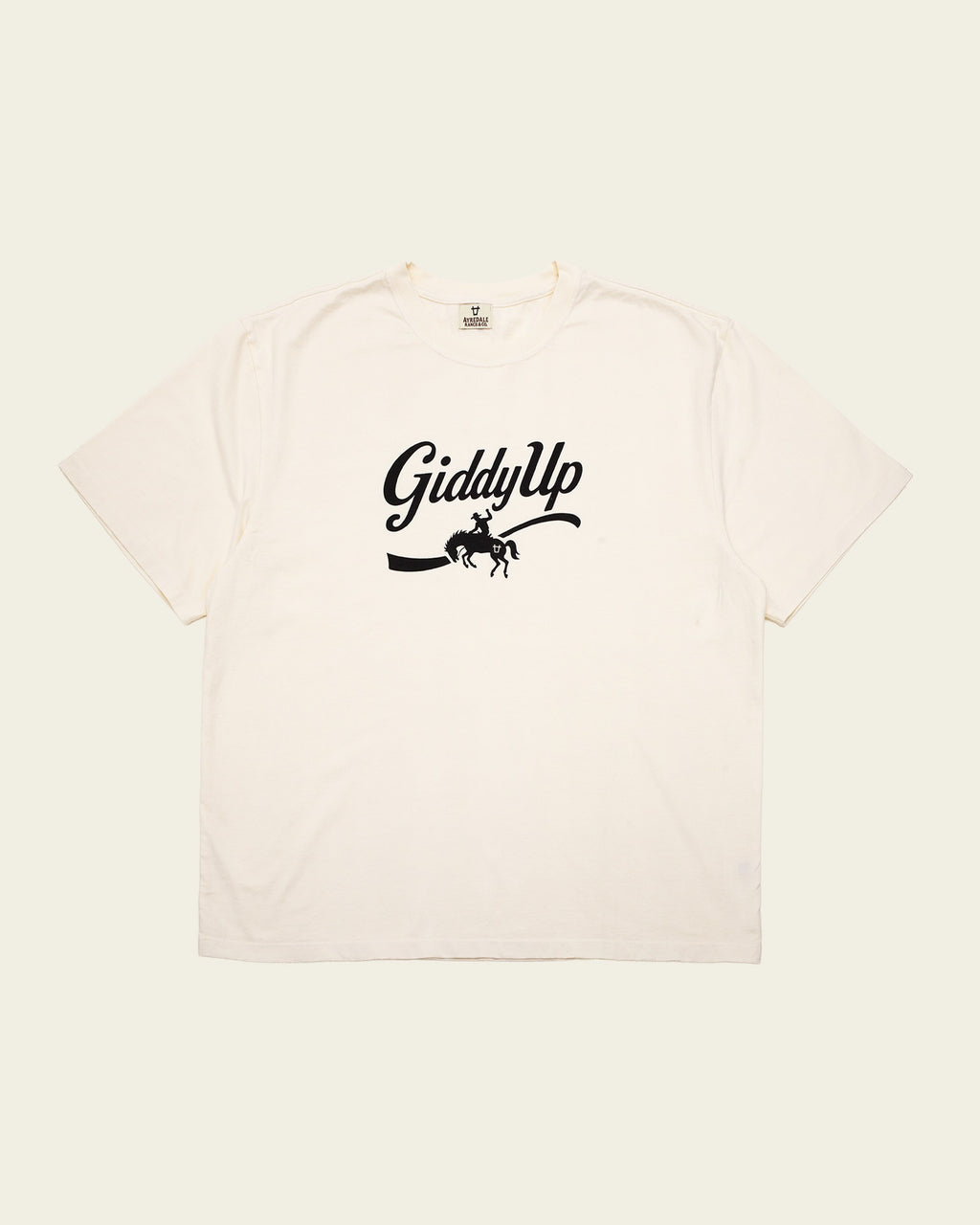 Ayredale Ranch & Co cream short-sleeve t-shirt with black GiddyUp graphic featuring a bucking bronco cowboy design.