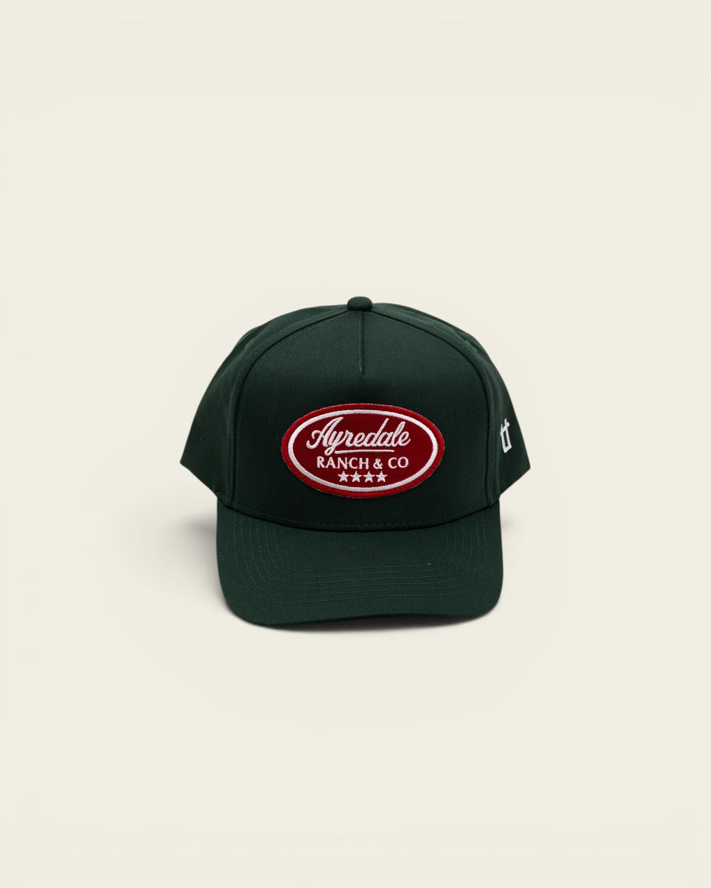 Ayredale Ranch & Co dark green baseball cap with a red oval embroidered logo patch and four stars