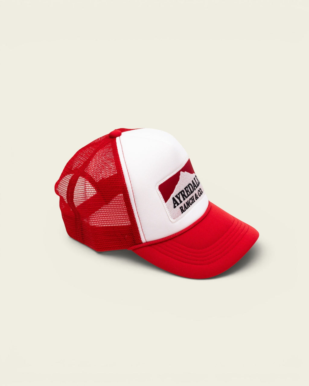 Ayredale Ranch & Co Mount Warning white and red trucker hat with mesh back and mountain logo patch