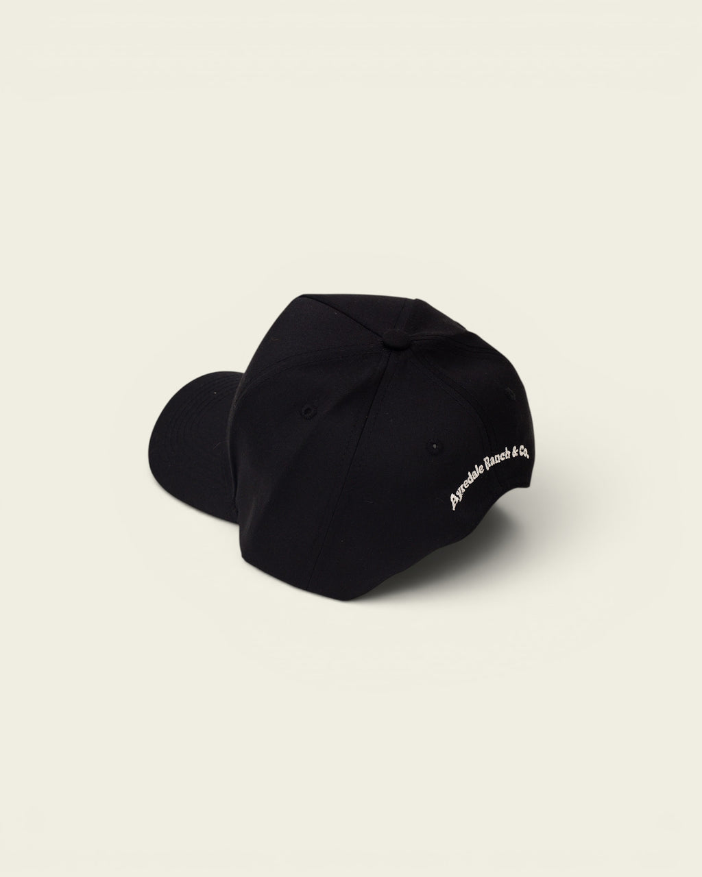 Ayredale Ranch & Co black baseball cap with embroidered logo on the side.