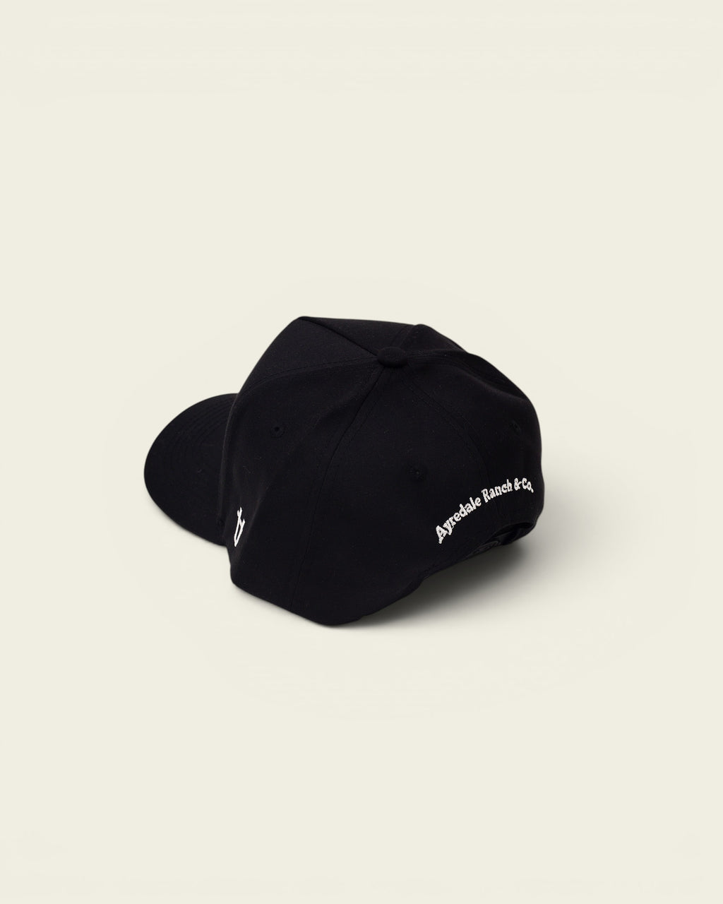 Ayredale Ranch & Co black baseball cap with embroidered logo on the side and text on the back.