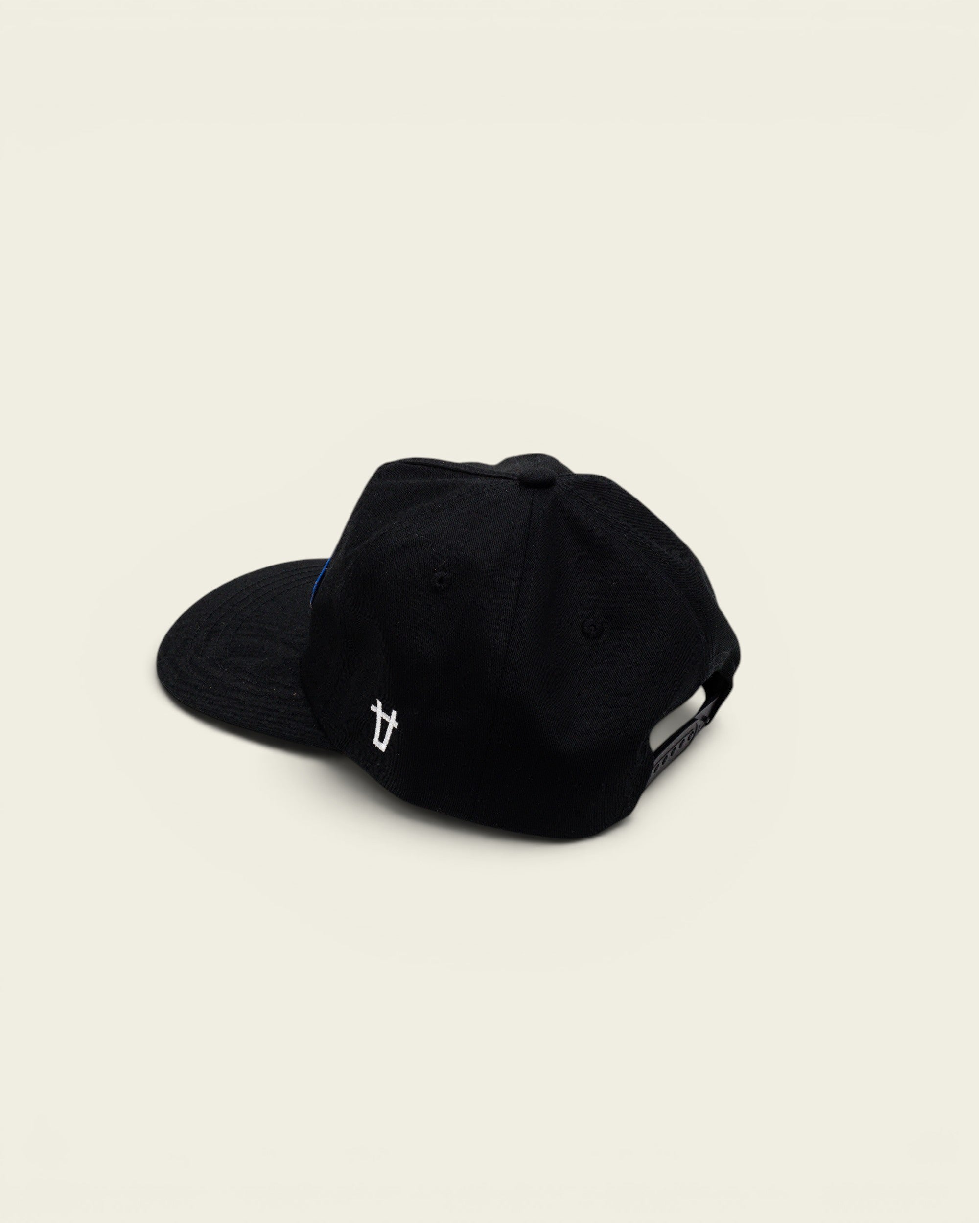 Ayredale Ranch & Co black snapback cap with a blue patch and white side logo embroidery on a white background.