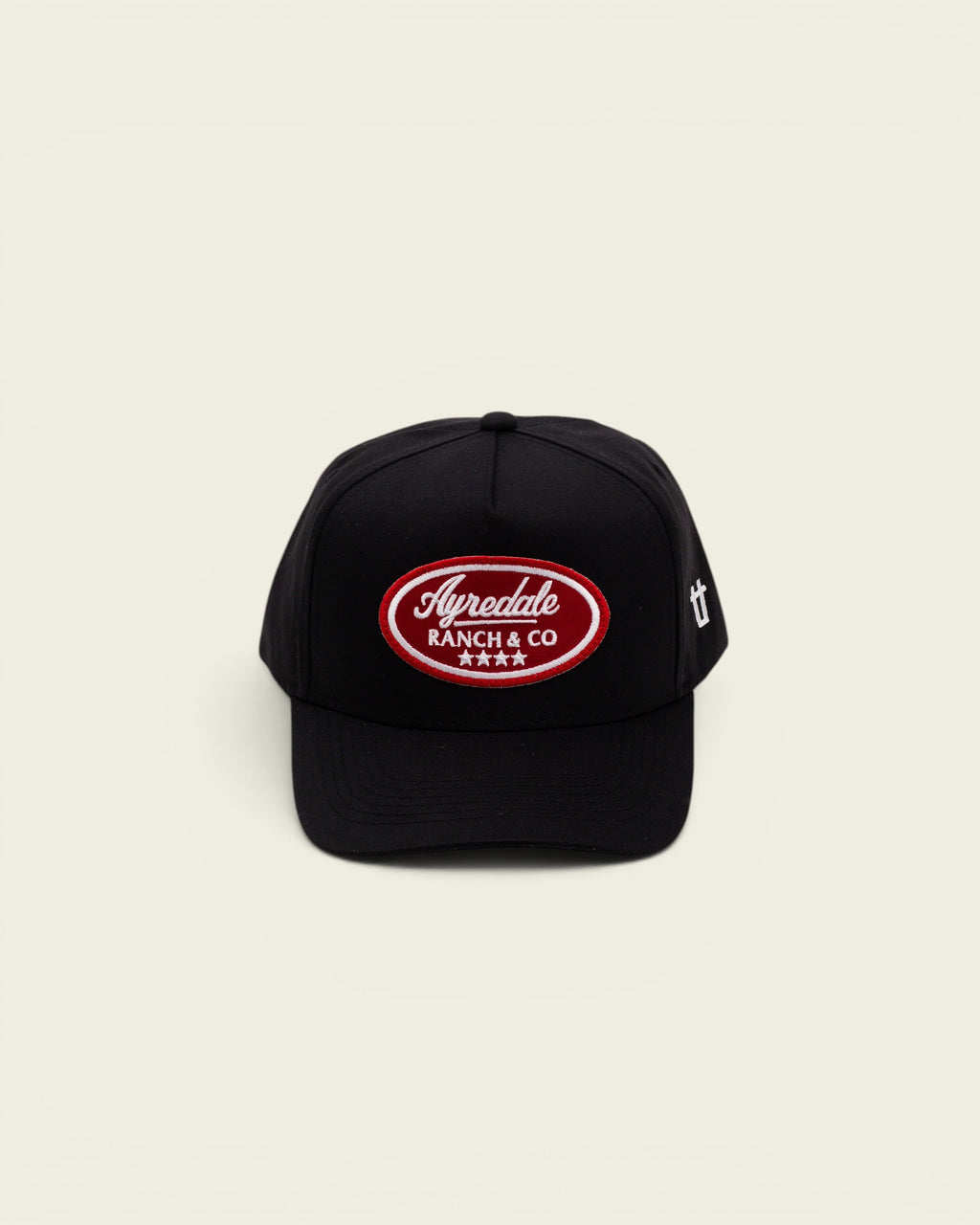 Ayredale Ranch & Co black baseball cap with a red oval embroidered patch featuring white text and four stars
