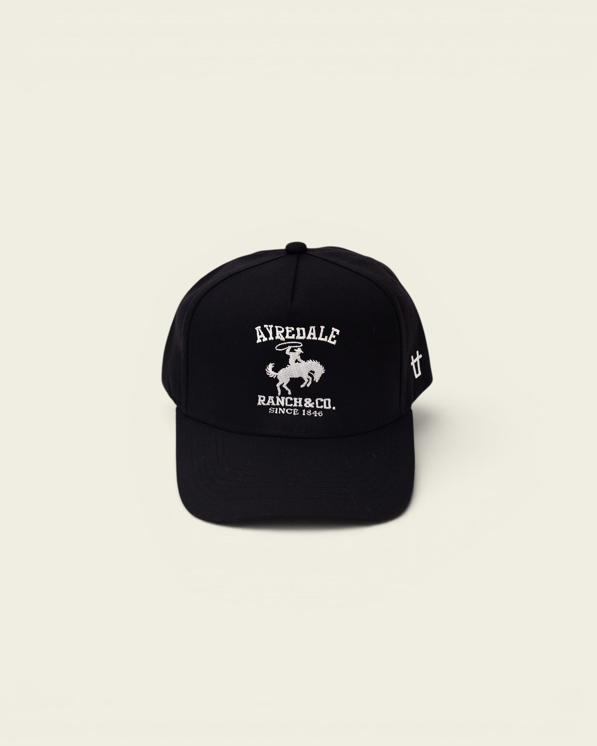 Ayredale Ranch & Co black baseball cap with embroidered rodeo rider logo and "Since 1846" text.