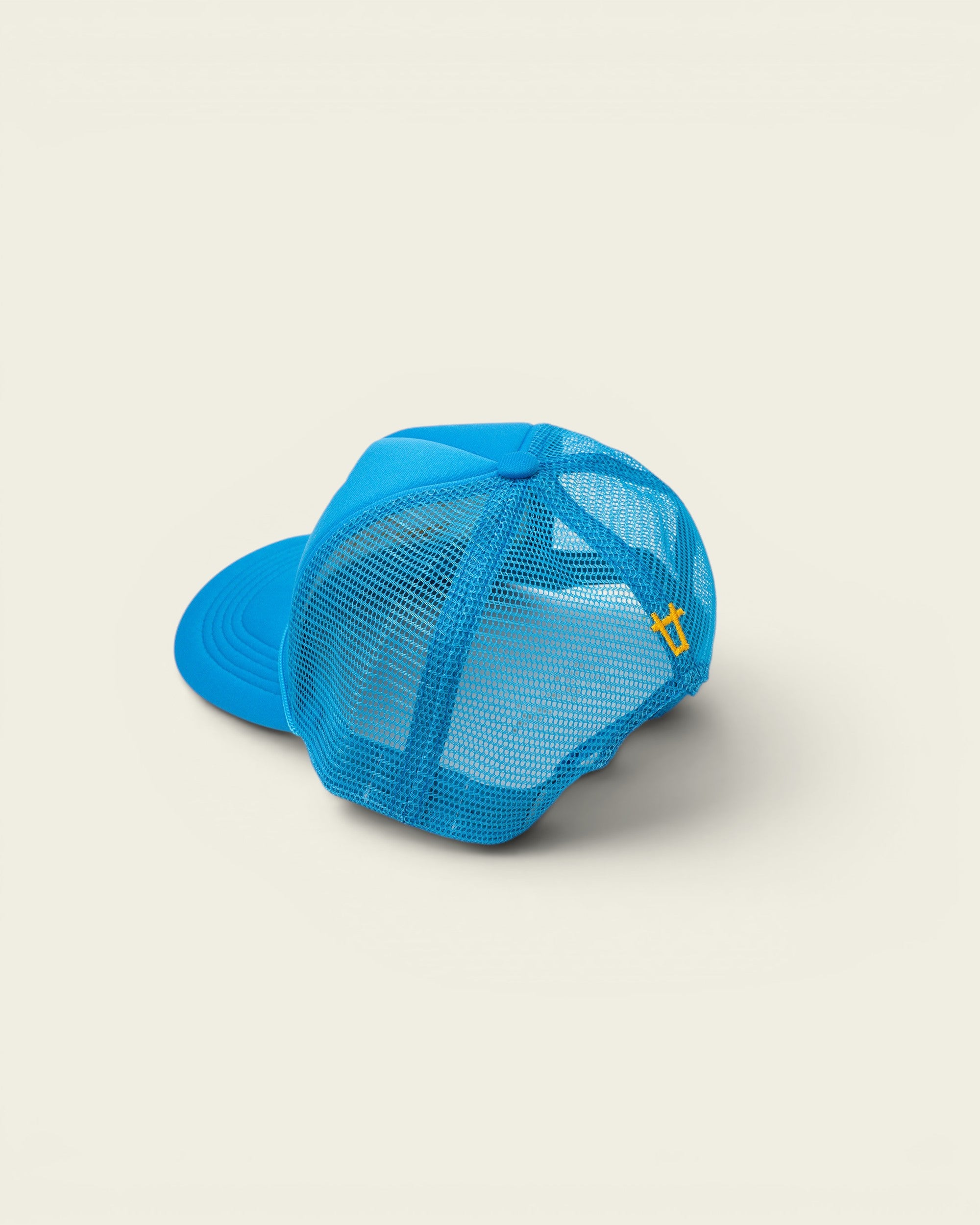 Ayredale Ranch & Co blue trucker hat with mesh back and yellow logo detail.