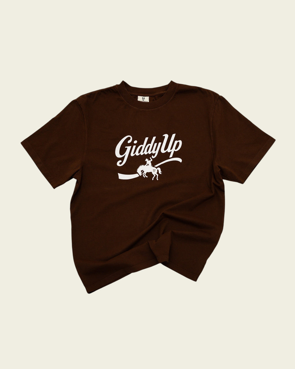Ayredale Ranch & Co brown crew neck t-shirt featuring a white GiddyUp graphic with a bucking bronco illustration.