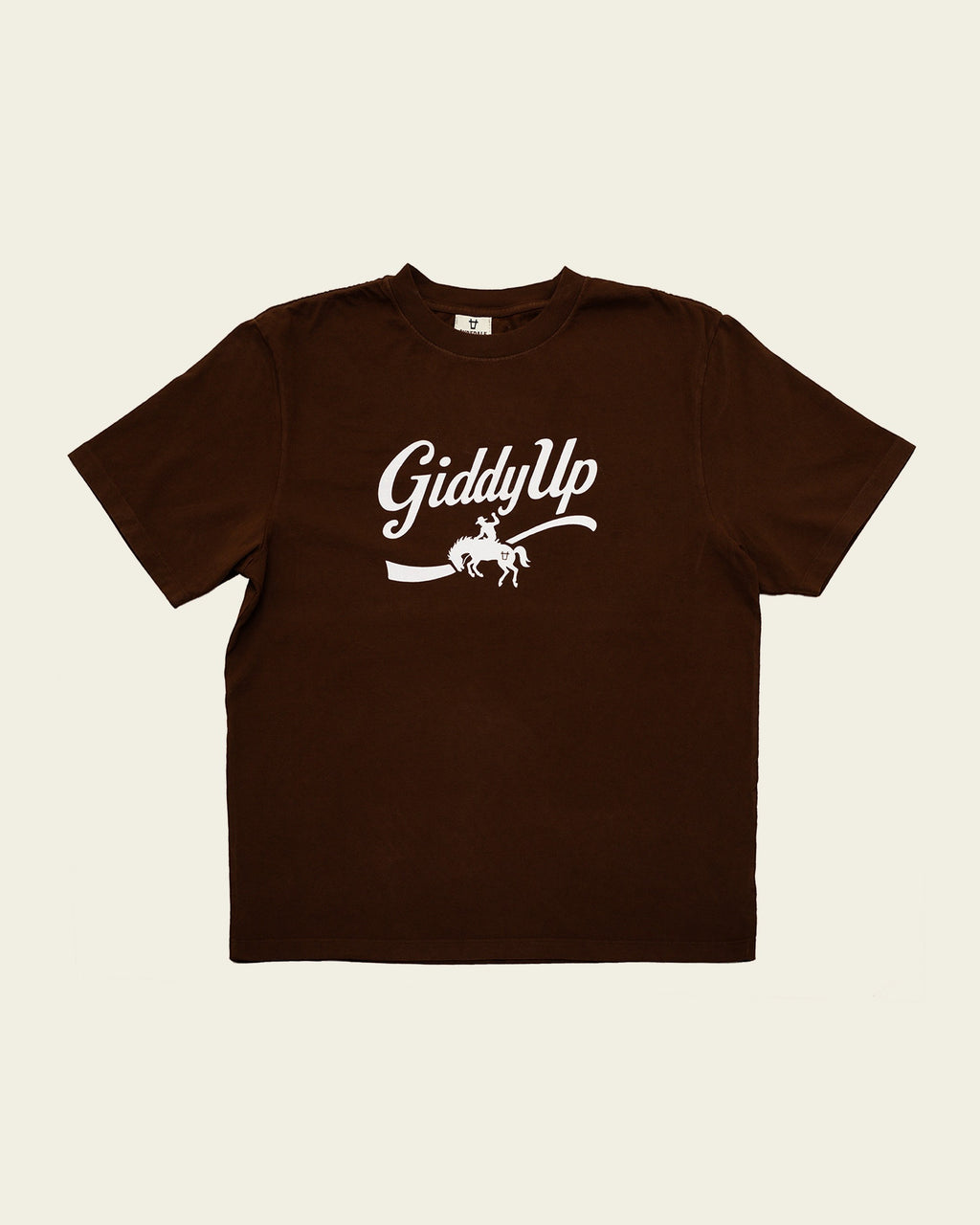 Ayredale Ranch & Co brown crew neck t-shirt featuring a white GiddyUp cowboy graphic on the chest.