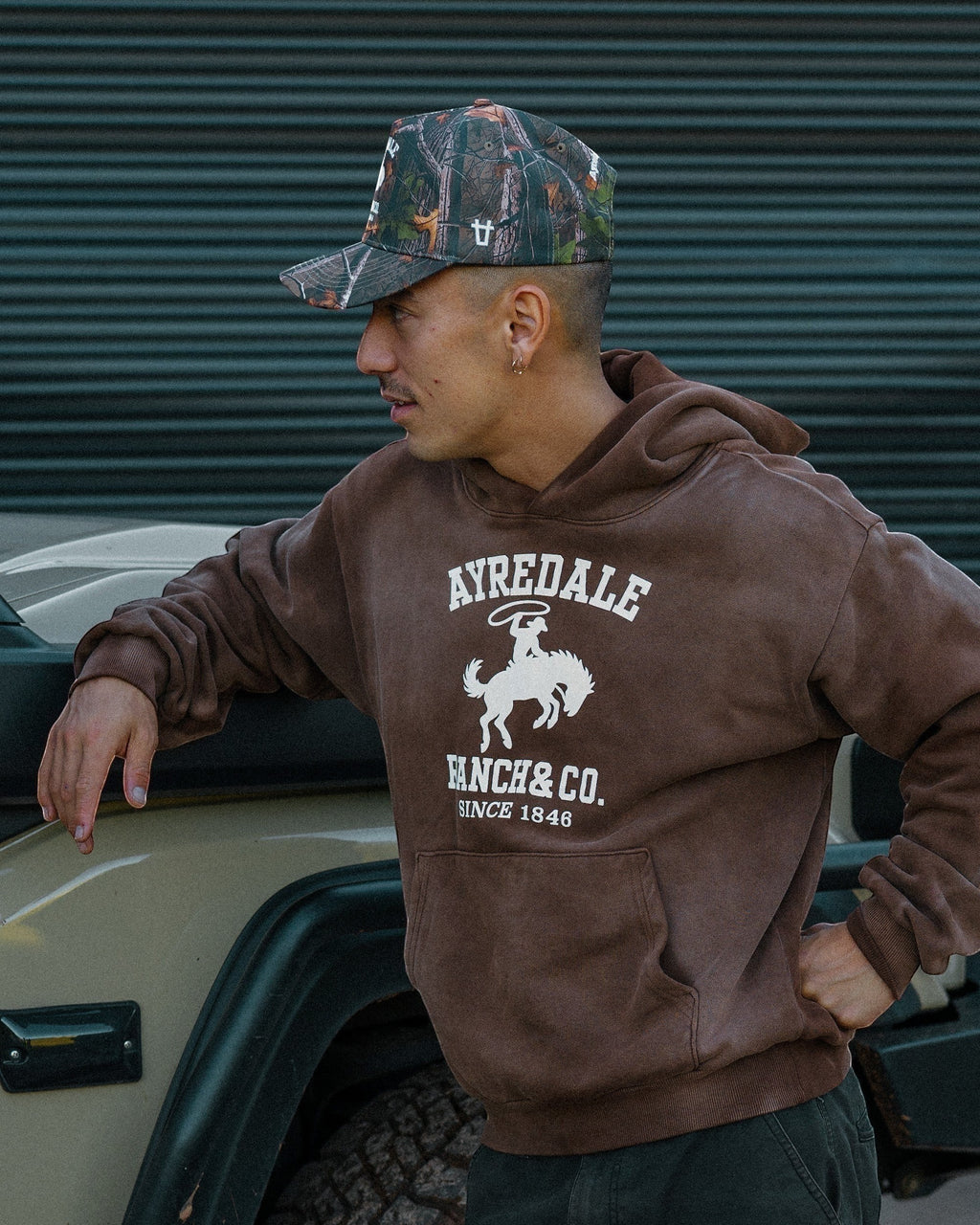 Ayredale Ranch & Co. brown heavyweight fleece hoodie with collegiate graphic and oversized fit.