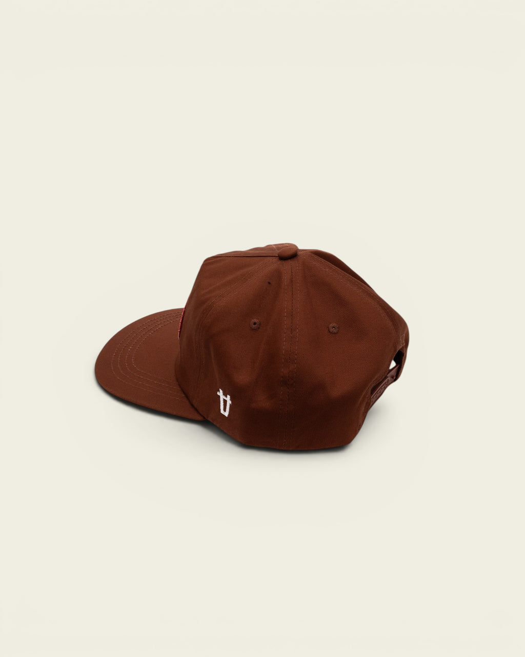 Ayredale Ranch & Co brown baseball cap with a red patch and white embroidered logo detail on the side