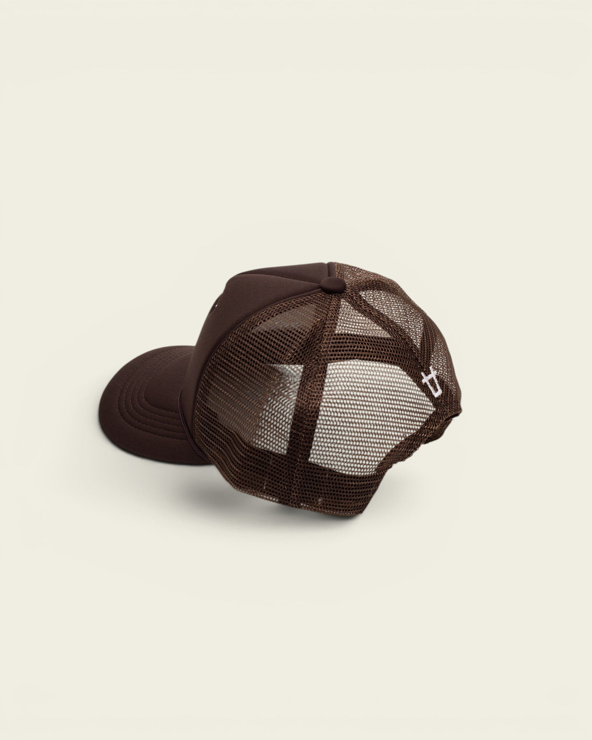 Ayredale Ranch & Co brown trucker hat with breathable mesh back and small white logo embroidery on the side.