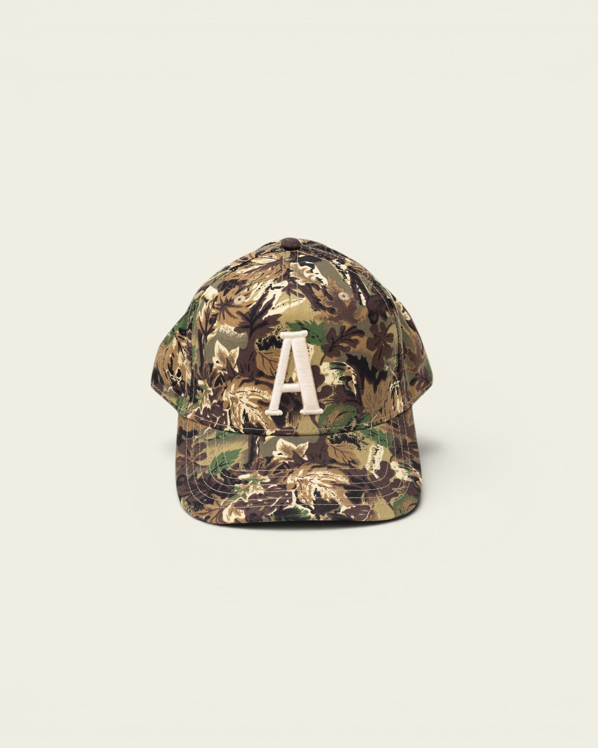 Ayredale Ranch & Co camouflage baseball cap with embroidered white letter A on the front.