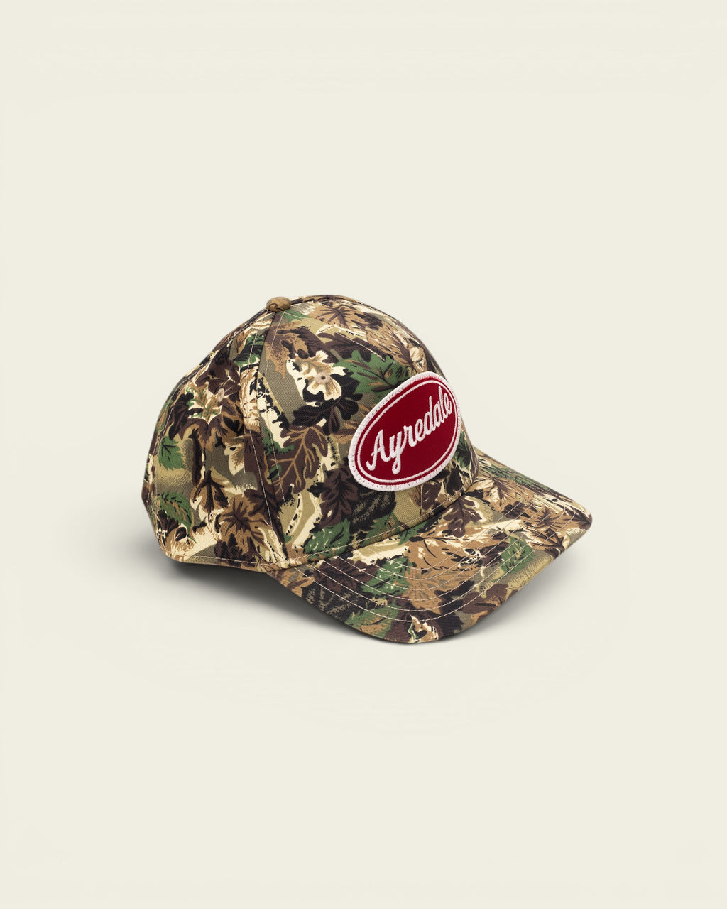Ayredale Ranch & Co camouflage baseball cap with red oval logo patch