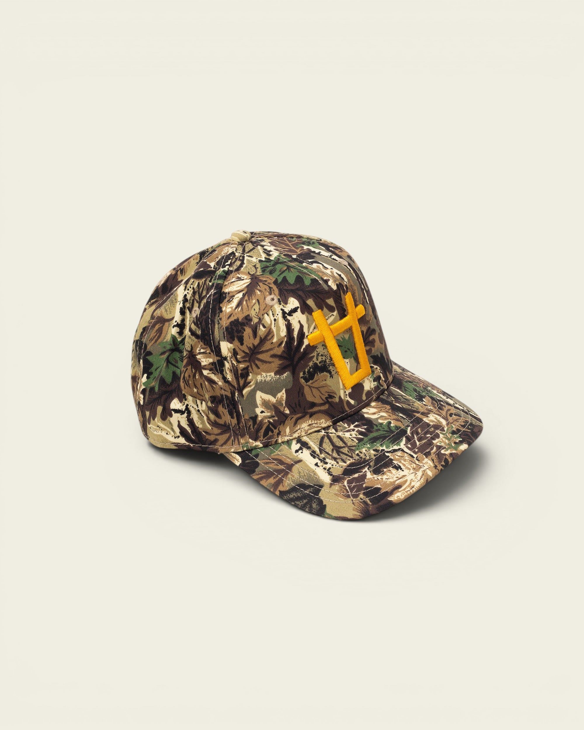Ayredale Ranch & Co camouflage baseball cap with yellow embroidered bull logo on the front.