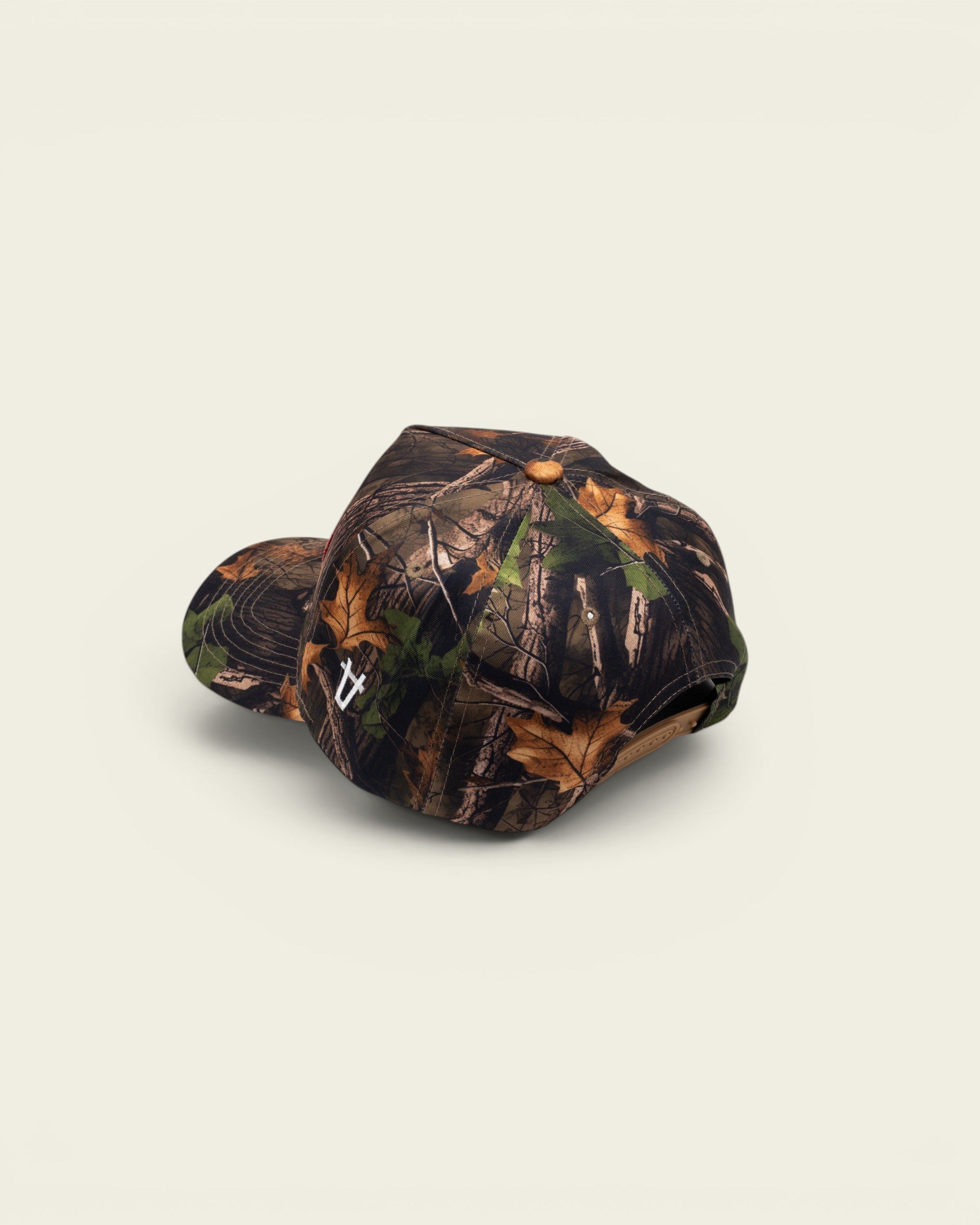 Ayredale Ranch & Co Ranch Camo Red baseball cap featuring a detailed forest leaf camouflage pattern and snapback.