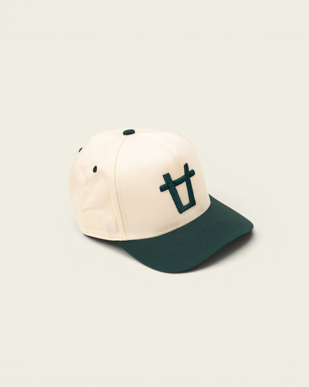 Ayredale Ranch & Co cream baseball cap with dark green brim and embroidered logo.