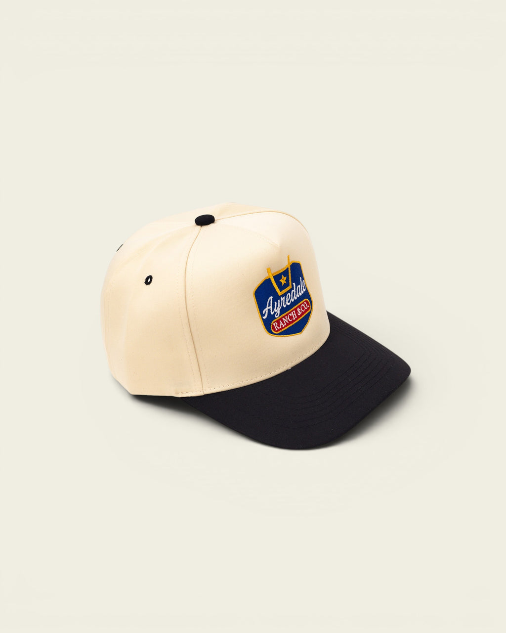 Ayredale Ranch & Co cream and black baseball cap with embroidered logo