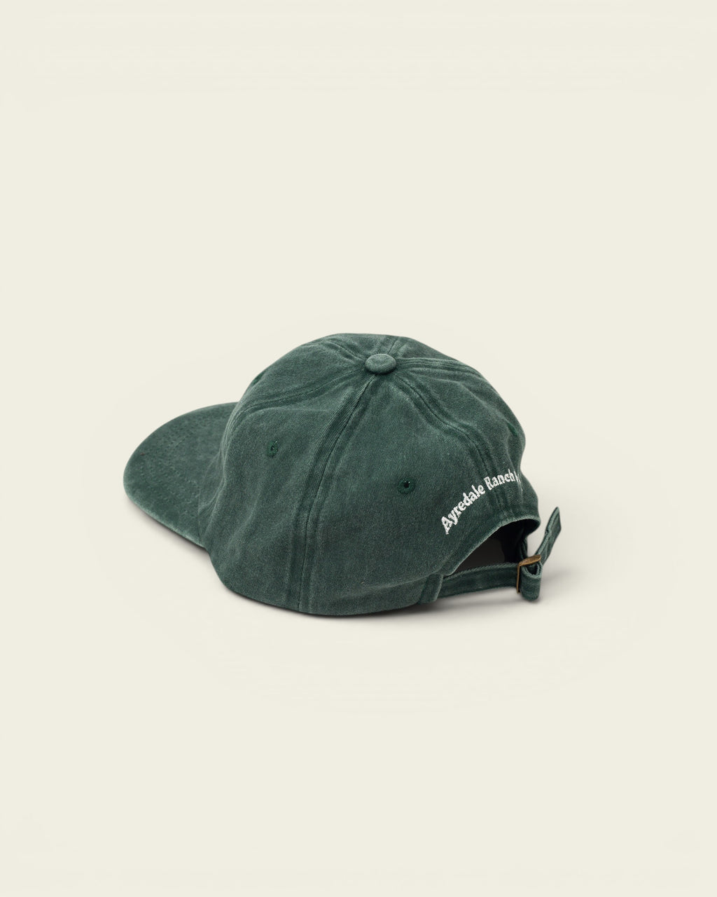 Ayredale Ranch & Co faded green cotton baseball cap with adjustable strap and embroidered logo on back.