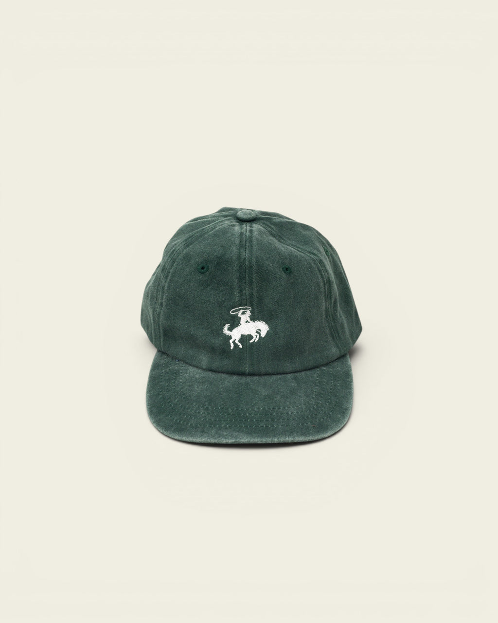Ayredale Ranch & Co faded green cotton baseball cap with white embroidered rodeo rider graphic on the front.