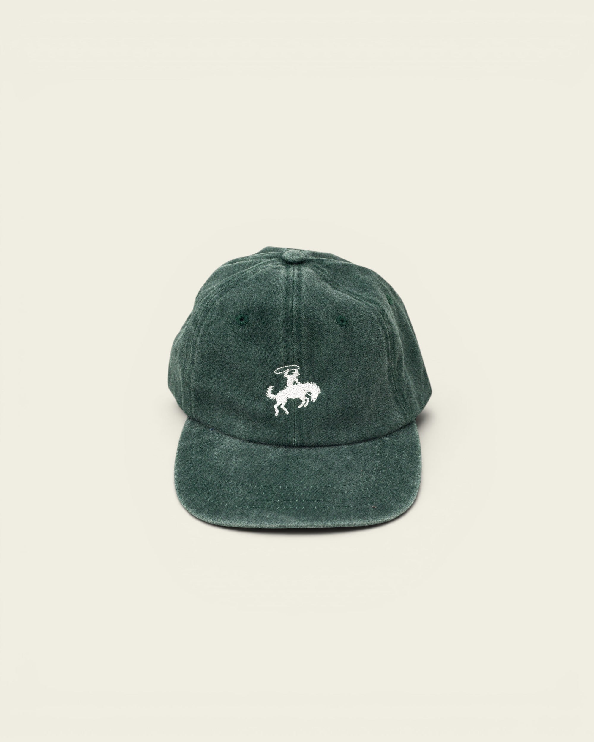 Ayredale Ranch & Co faded green cotton baseball cap with white embroidered rodeo rider graphic on the front.