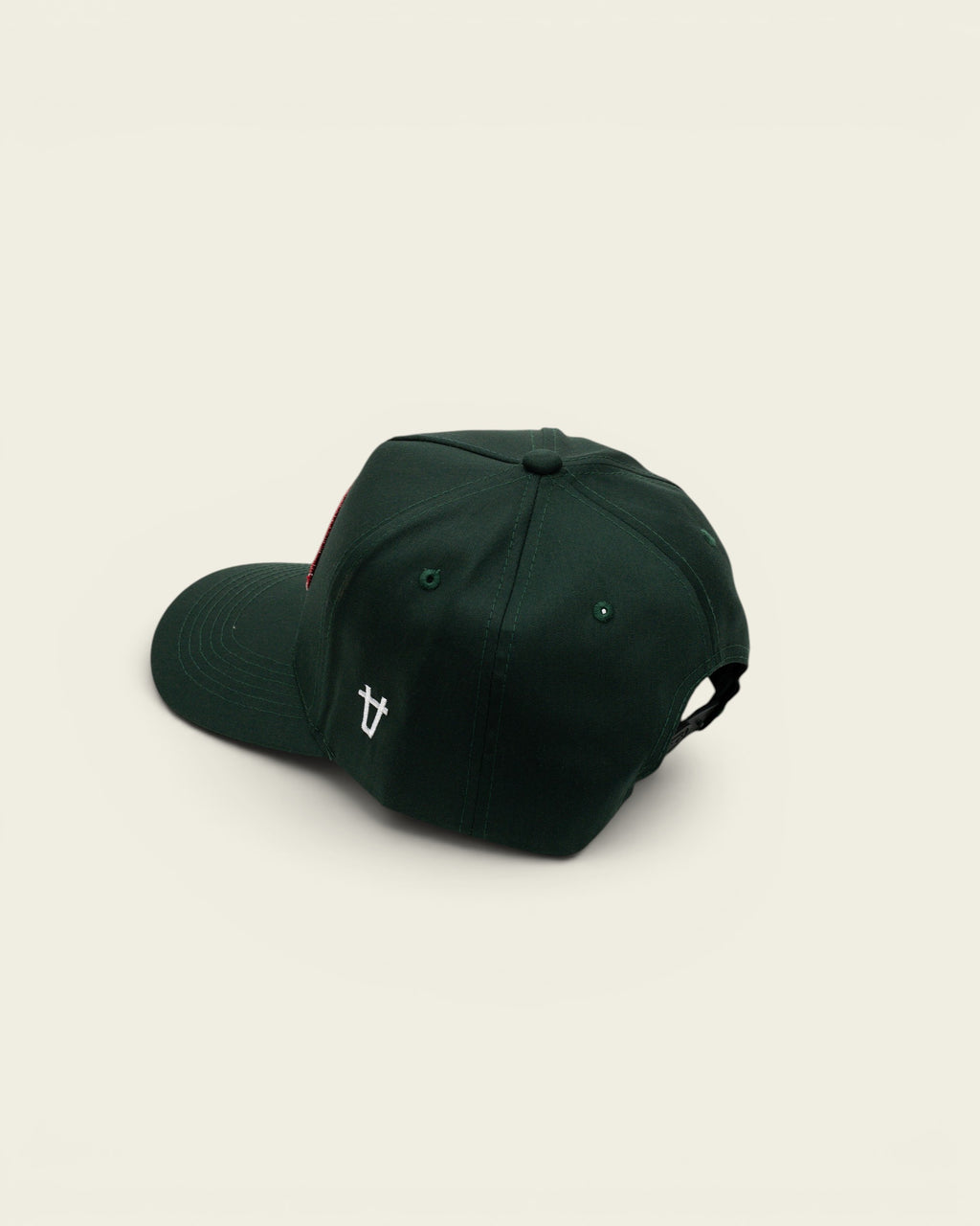 Ayredale Ranch & Co dark green baseball cap with a red logo patch and white side embroidery on a white background