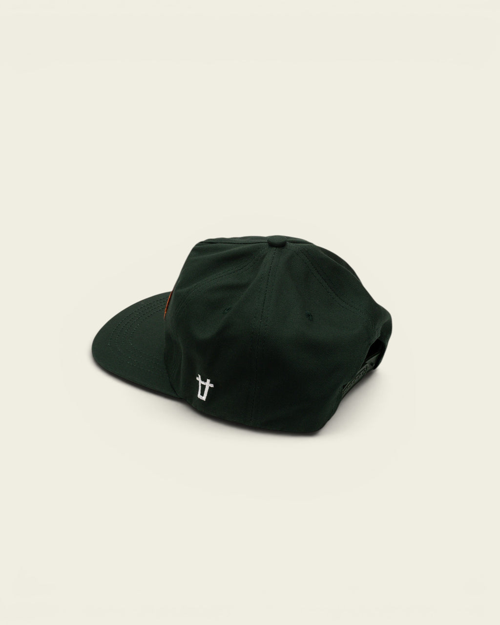 Ayredale Ranch & Co dark green snapback cap with an orange patch and white logo embroidery on the side