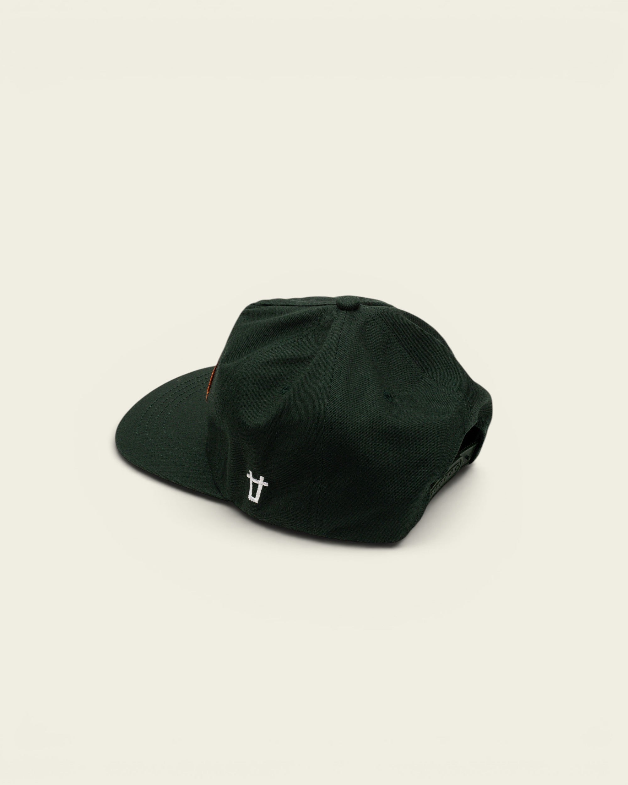 Ayredale Ranch & Co dark green snapback cap with an orange patch and white logo embroidery on the side