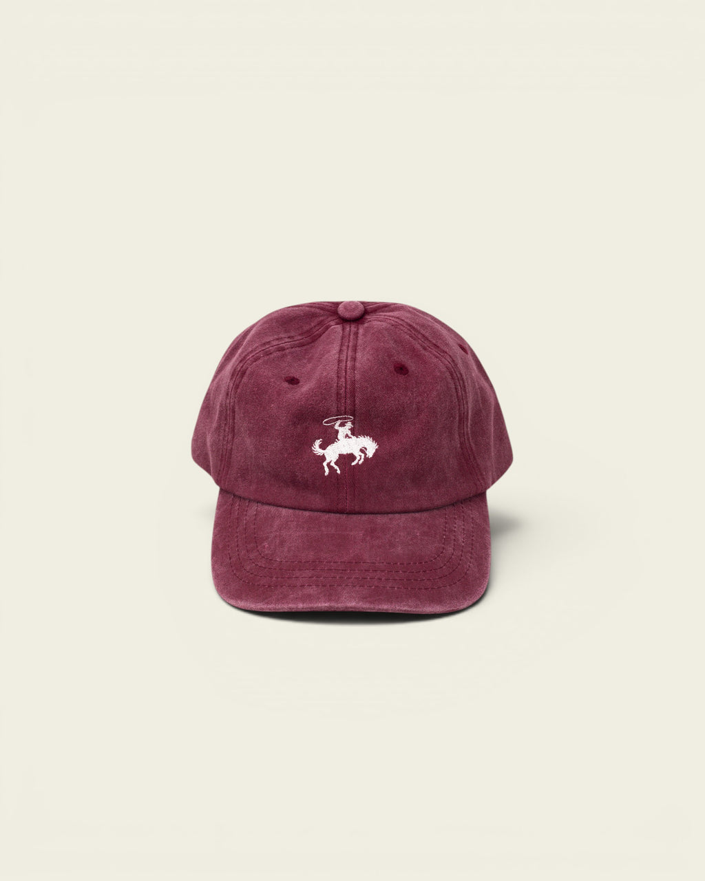 Ayredale Ranch & Co faded maroon rodeo baseball cap with white embroidered bucking bronco and rider.