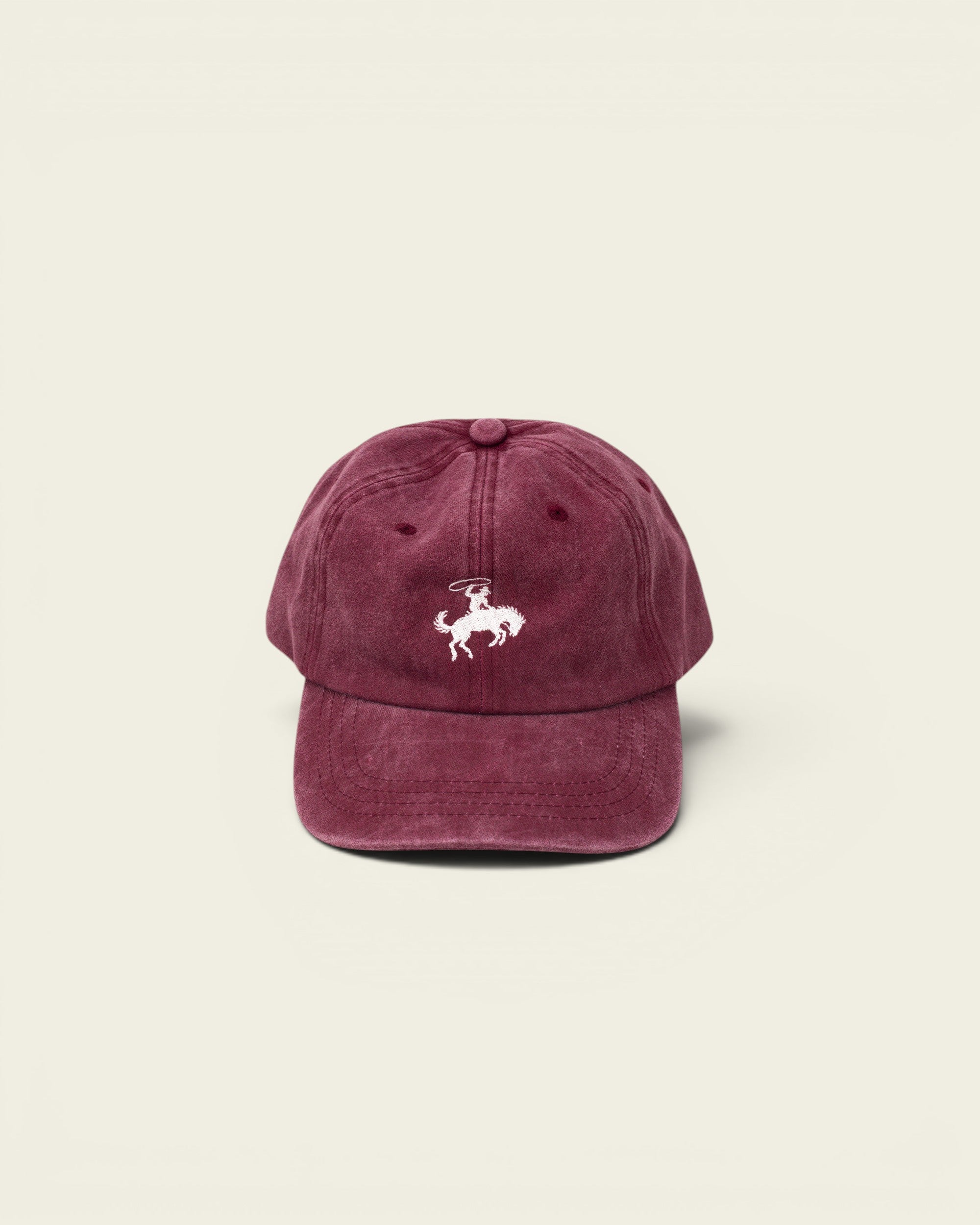 Ayredale Ranch & Co faded maroon rodeo baseball cap with white embroidered bucking bronco and rider.