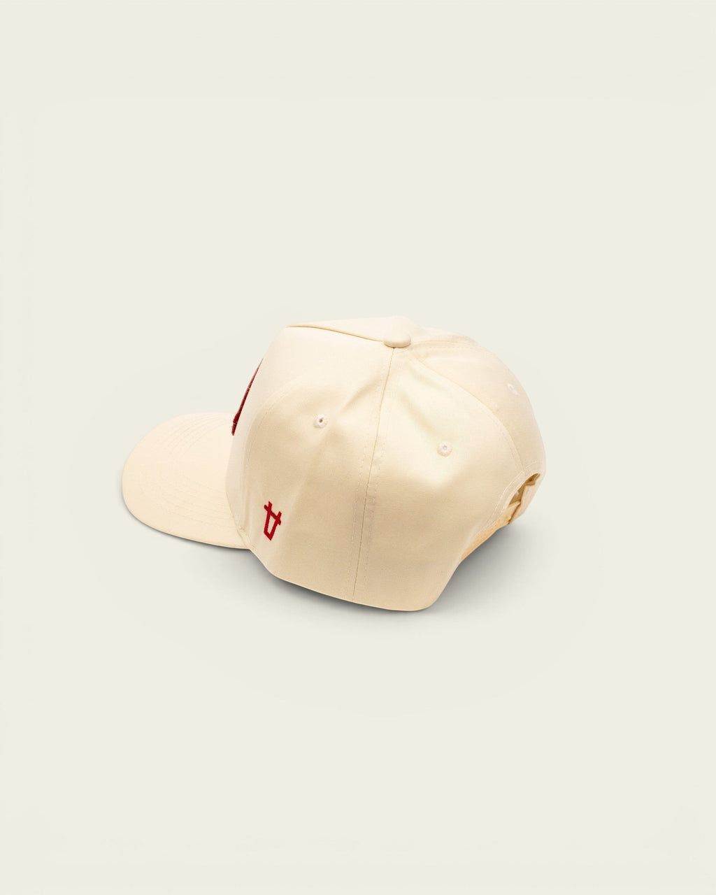 Ayredale Ranch & Co off-white baseball cap with a red embroidered patch and small red logo detail on the side.