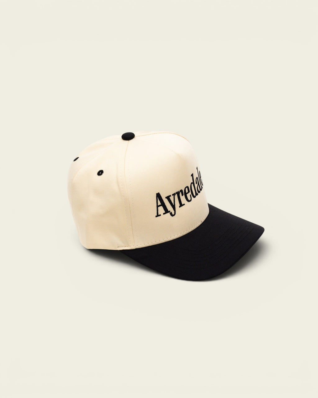 Ayredale Ranch & Co Ayredale OG baseball cap in cream with a black brim and black embroidered logo lettering.