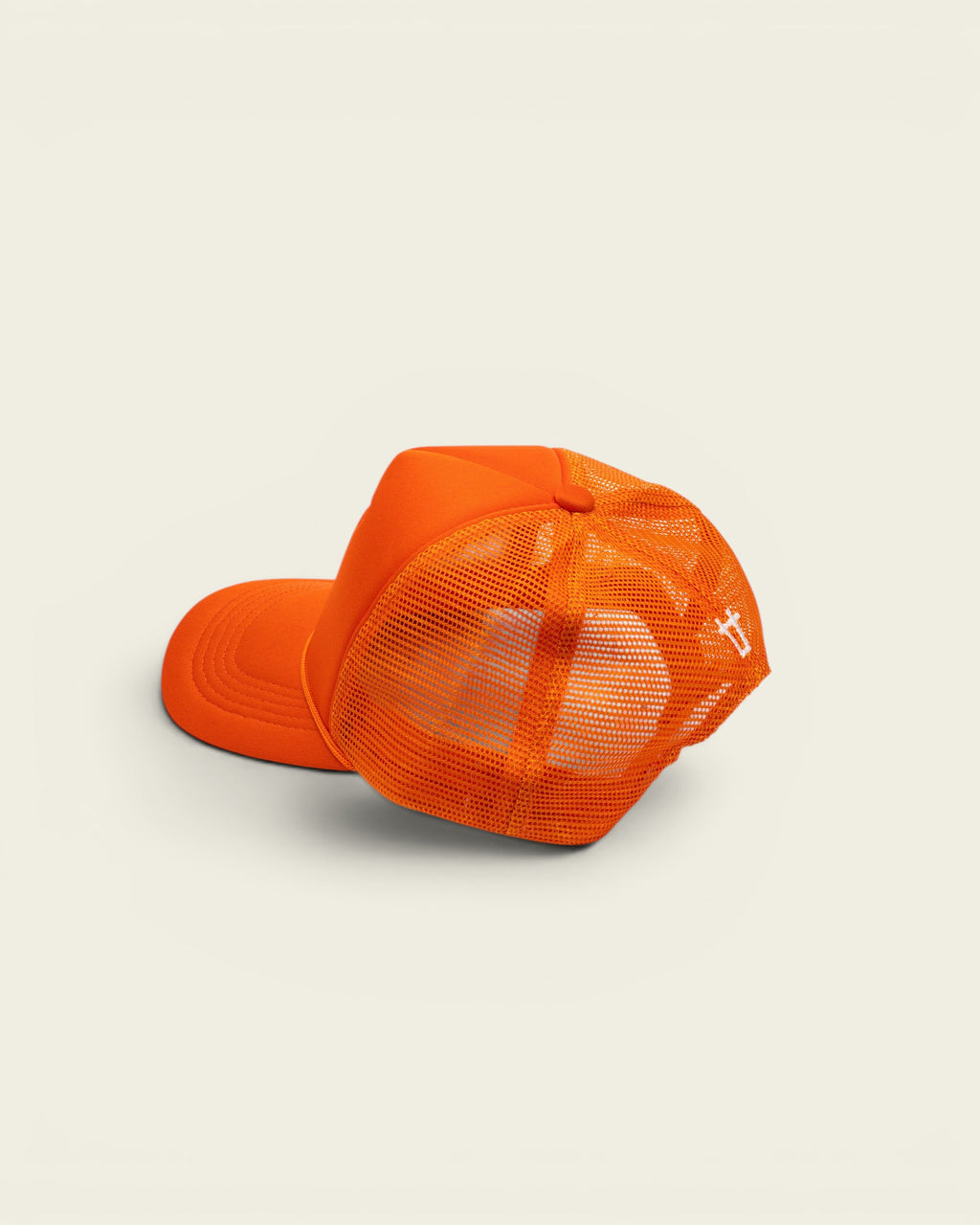 Ayredale Ranch & Co bright orange trucker hat with breathable mesh back and adjustable snapback closure