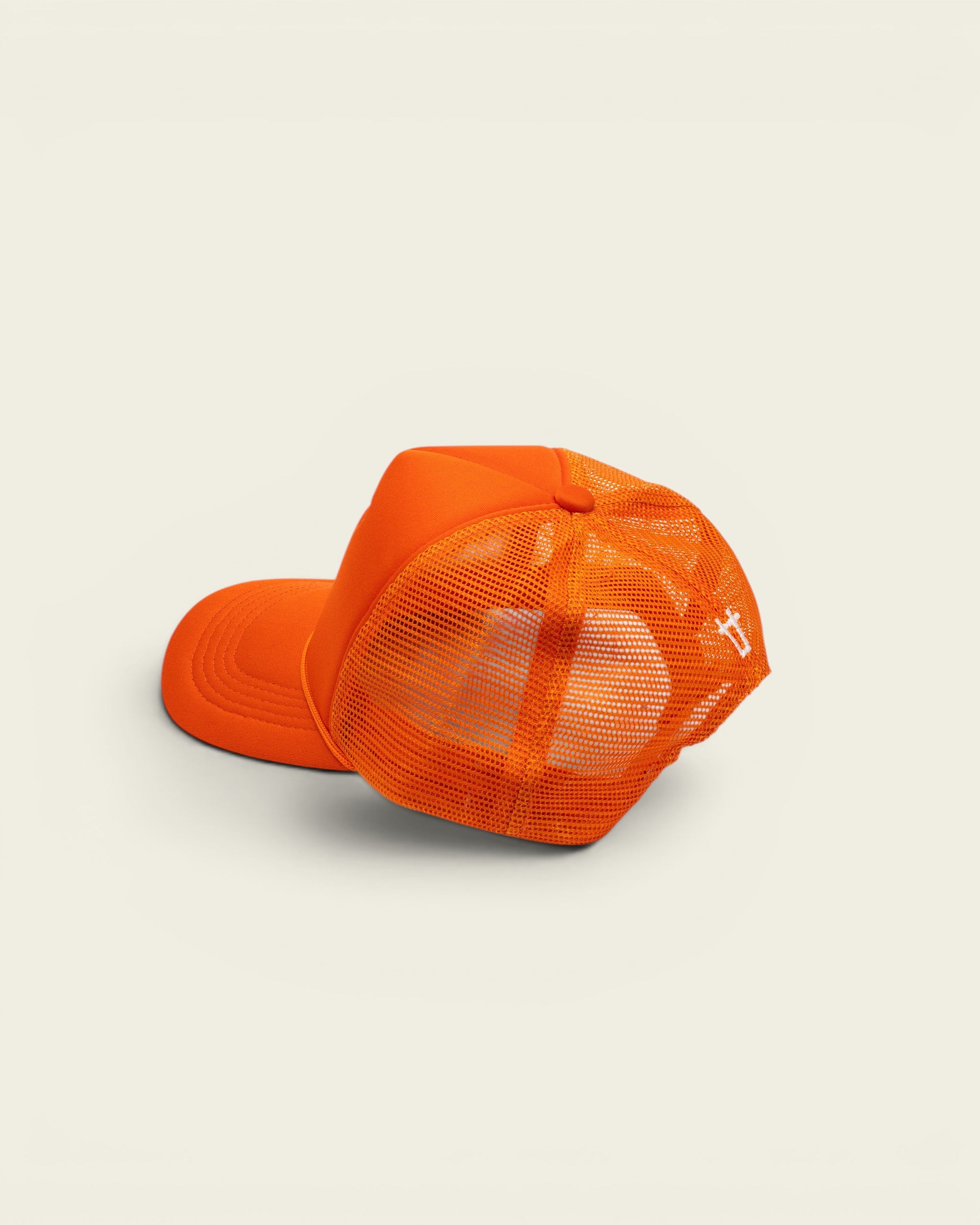 Ayredale Ranch & Co bright orange trucker hat with breathable mesh back and adjustable snapback closure