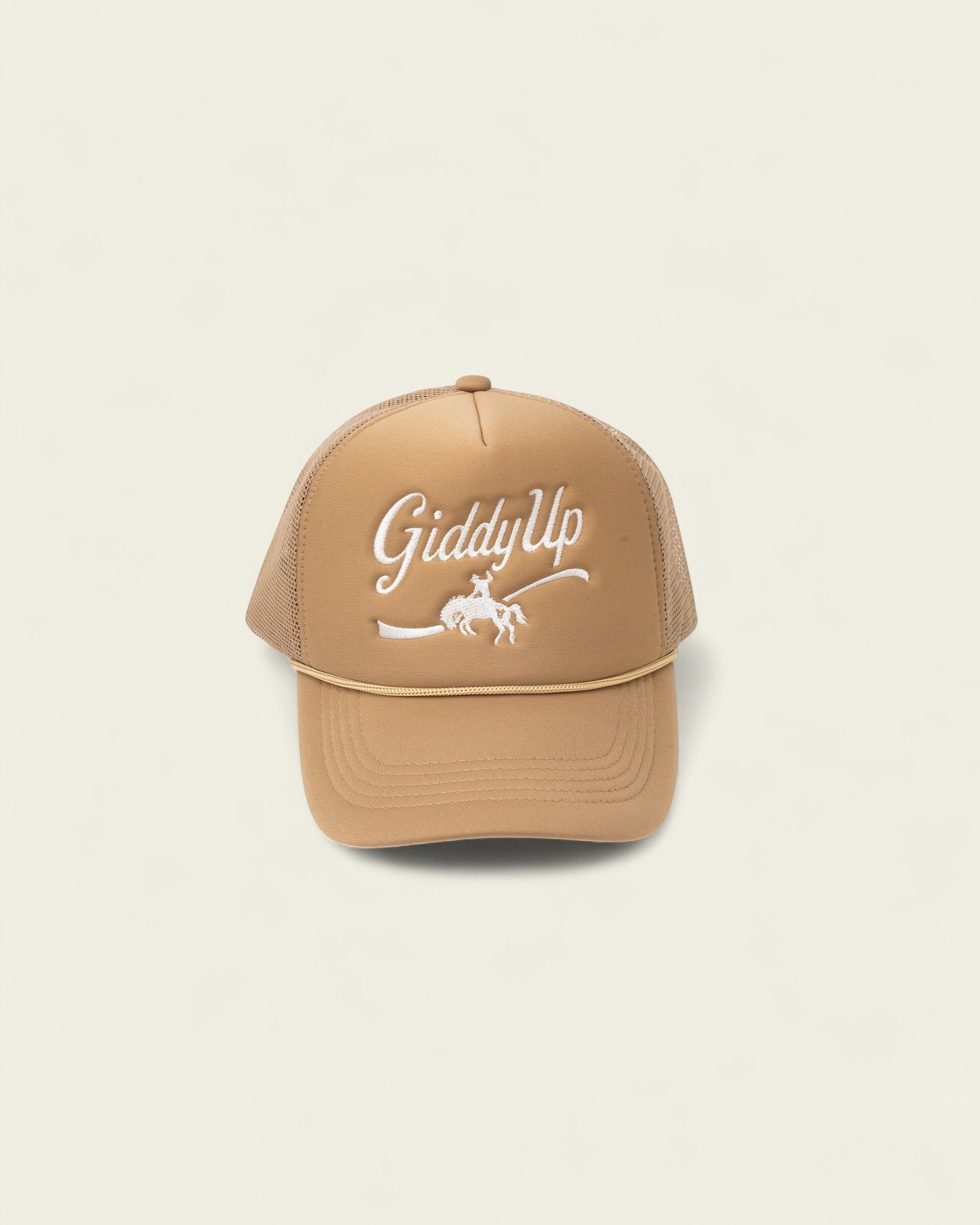 Ayredale Ranch & Co tan trucker hat with white "Giddy Up" embroidery and a horse rider graphic.