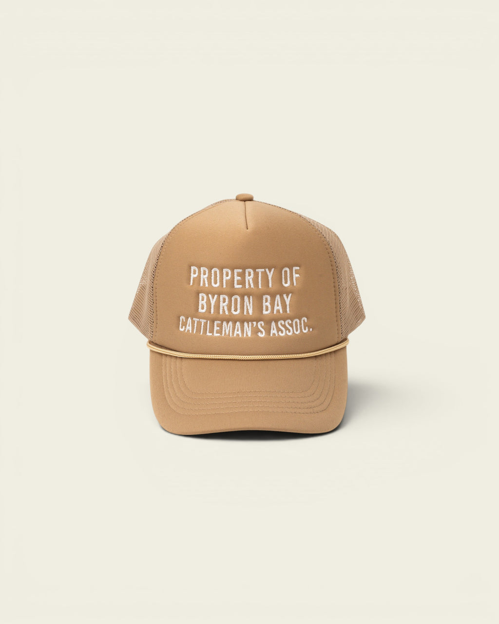 Ayredale Ranch & Co tan trucker hat with white embroidered text "PROPERTY OF BYRON BAY CATTLEMAN'S ASSOC."