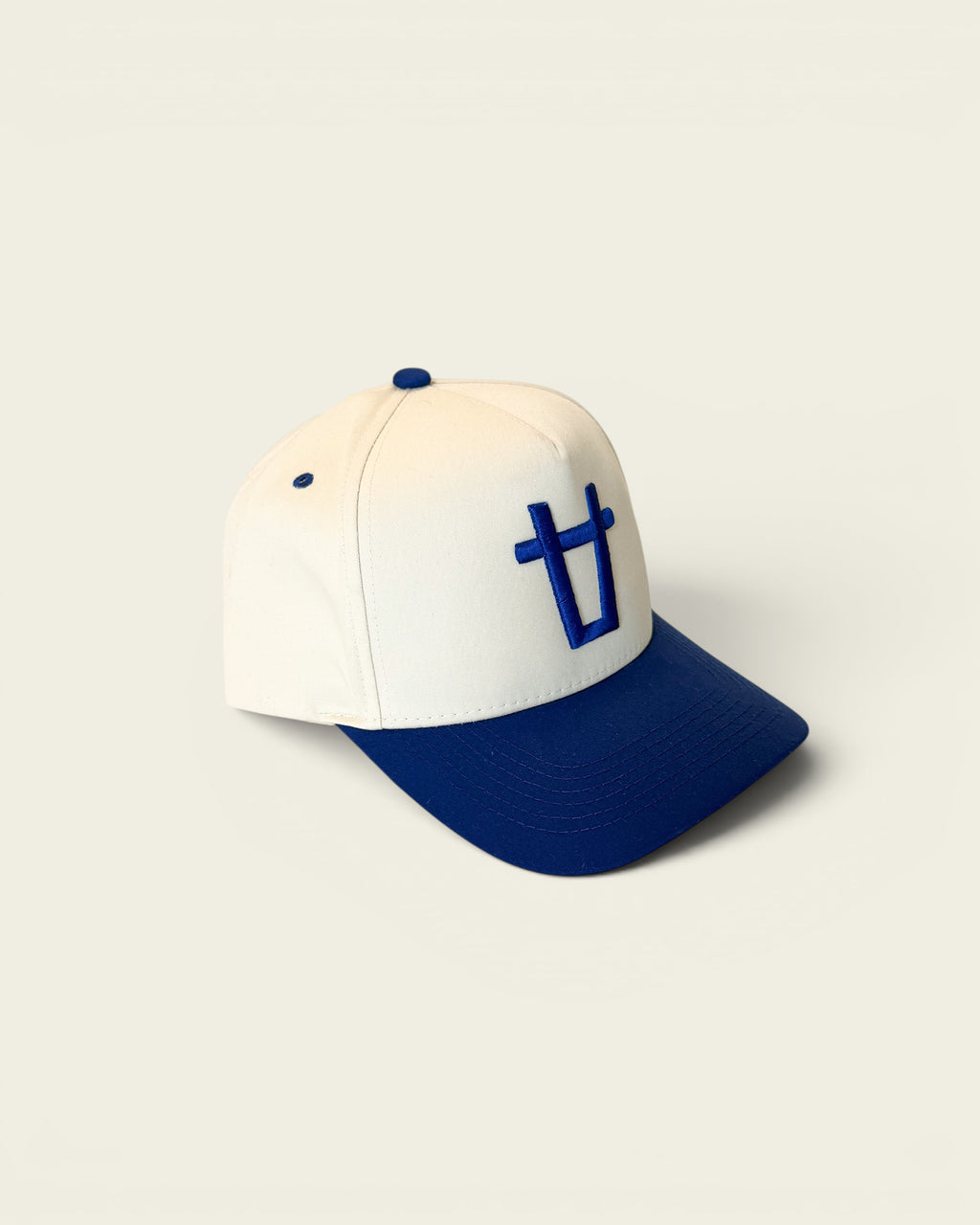 Ayredale Ranch & Co white baseball cap with blue brim and embroidered blue bull head logo on front.