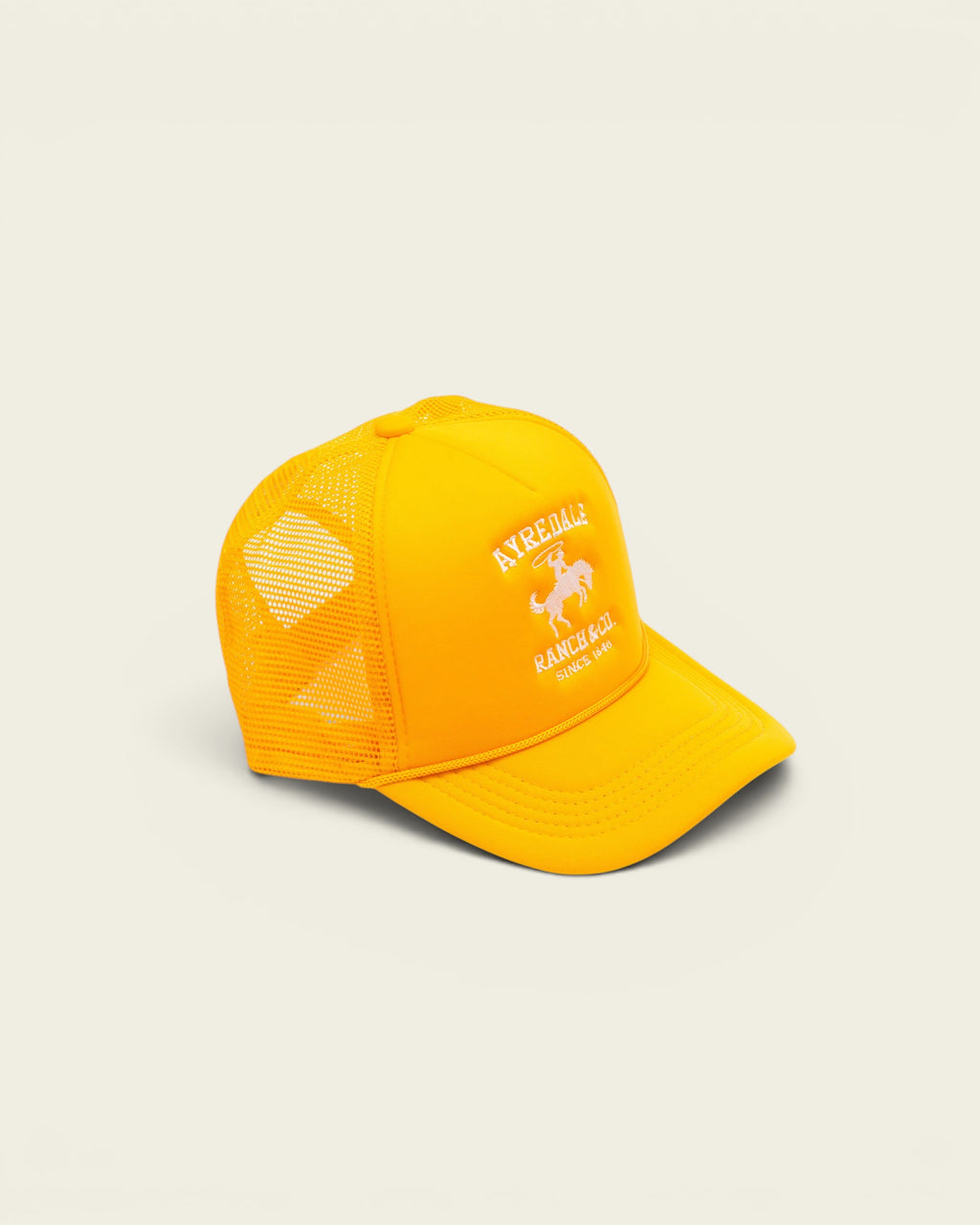 Ayredale Ranch & Co yellow trucker hat with white cowboy logo embroidery and breathable mesh back panel