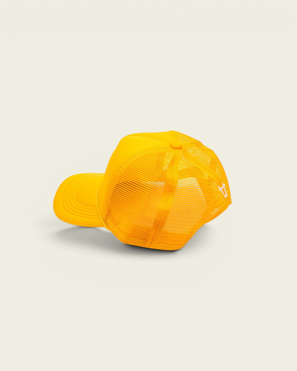 Ayredale Ranch & Co bright yellow trucker hat with mesh back and small white logo embroidery on the side