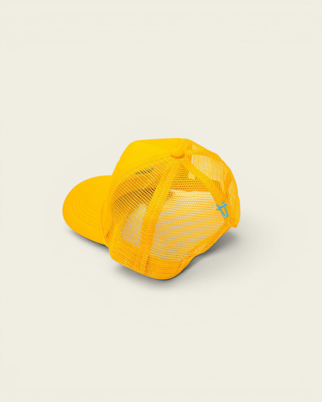 Ayredale Ranch & Co yellow mesh trucker hat with a curved brim and a small turquoise logo detail on the back.