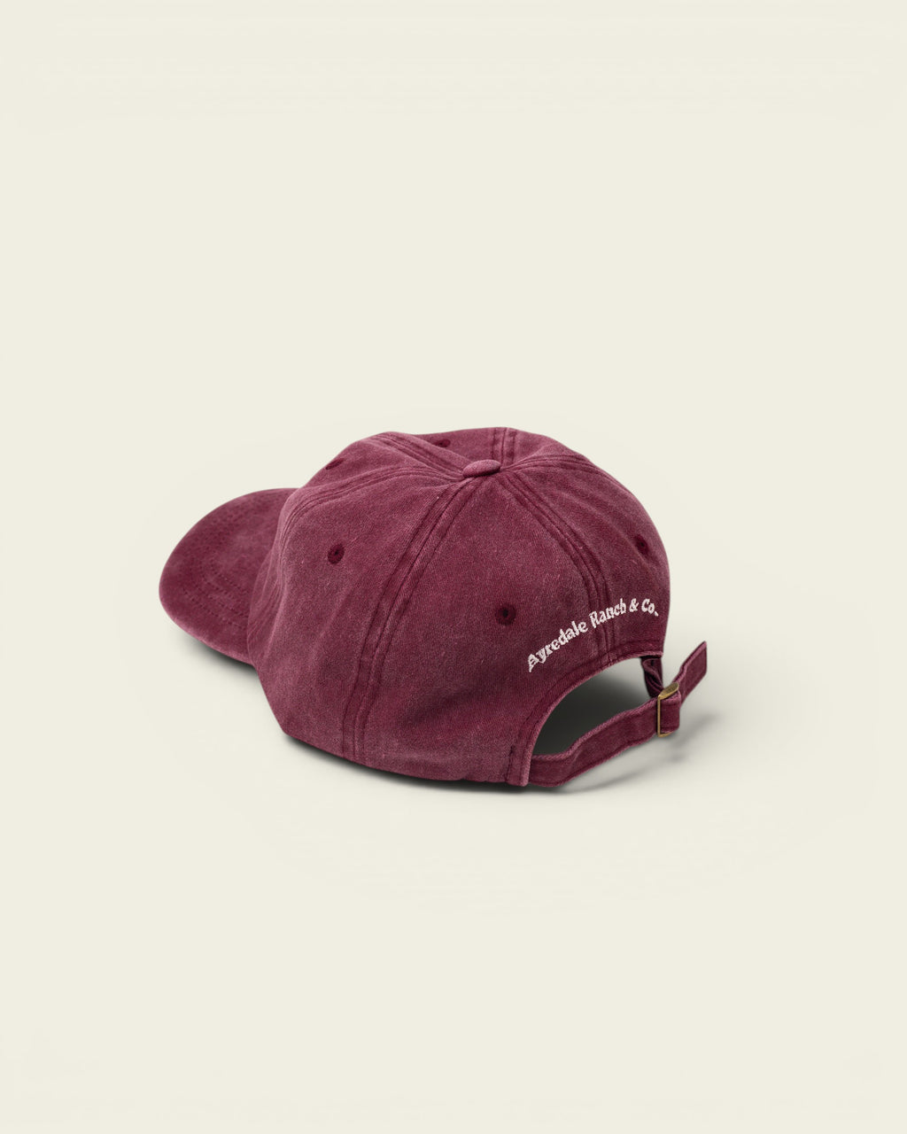 Ayredale Ranch & Co faded maroon washed cotton baseball cap with adjustable strap.